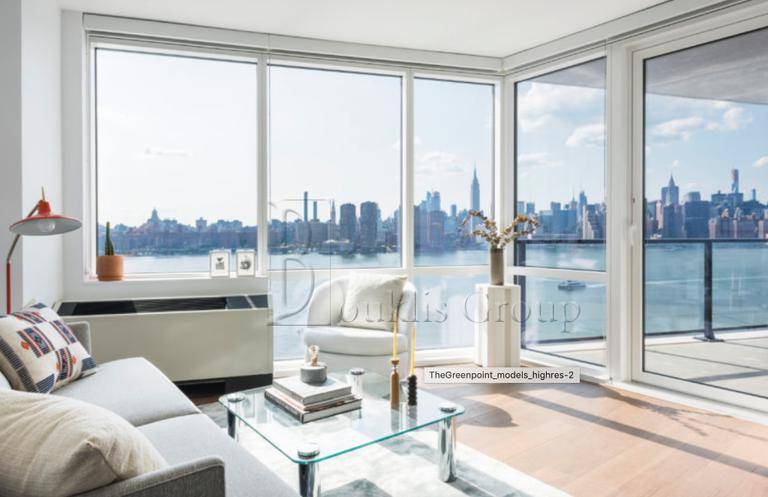 WALK INTO THIS ULTRA MODERN LUXURIOUS SUN FILLED FLOOR TO CEILING WINDOWS CONDO WITH STRIKING VIEWS OF THE MANHATTAN SKYLINE.