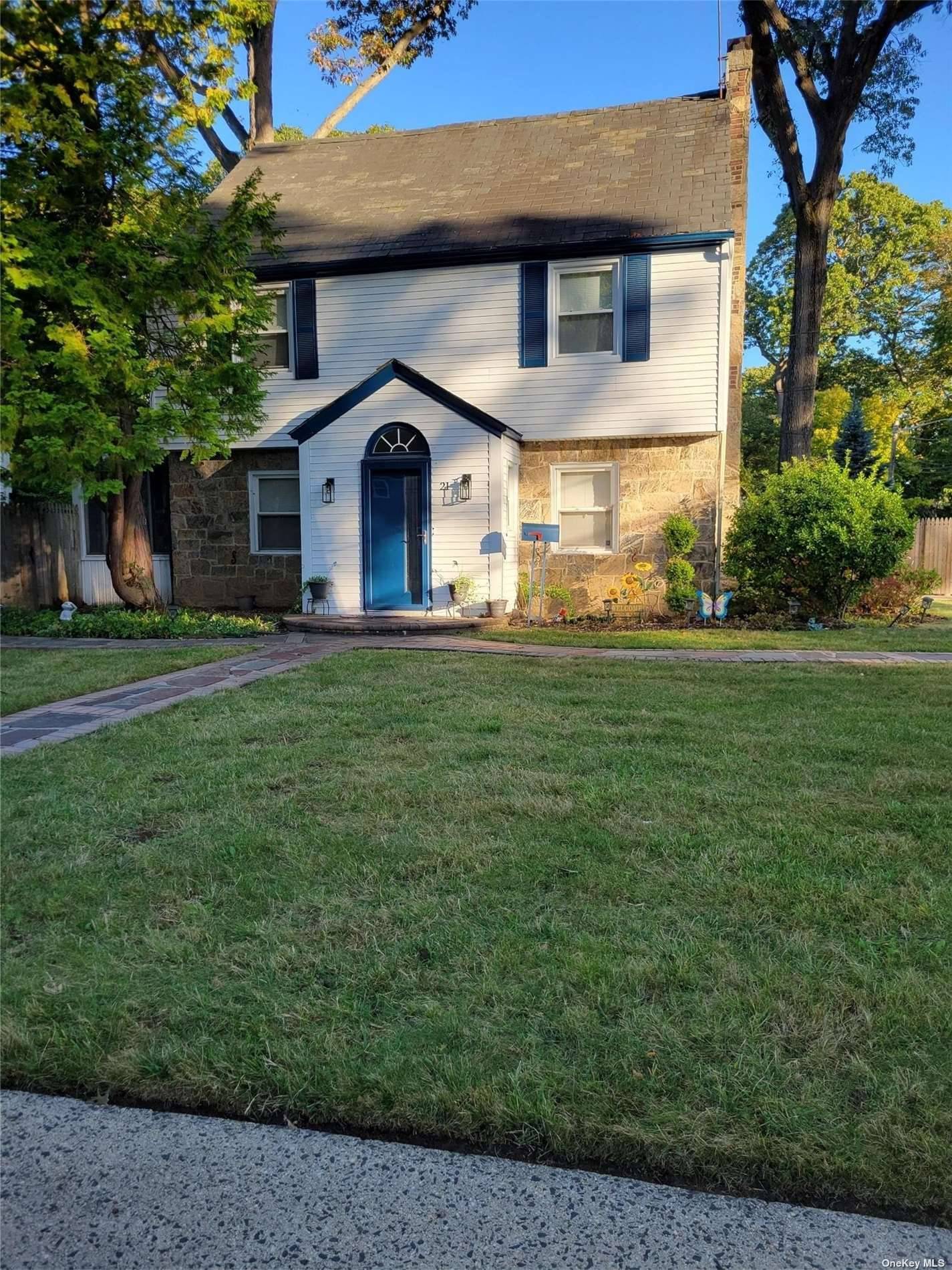 This is a charming, spacious Colonial on a corner lot with a wood burning fireplace and hardwood floors, formal dining room a Florida room that lets in lots of light, ...