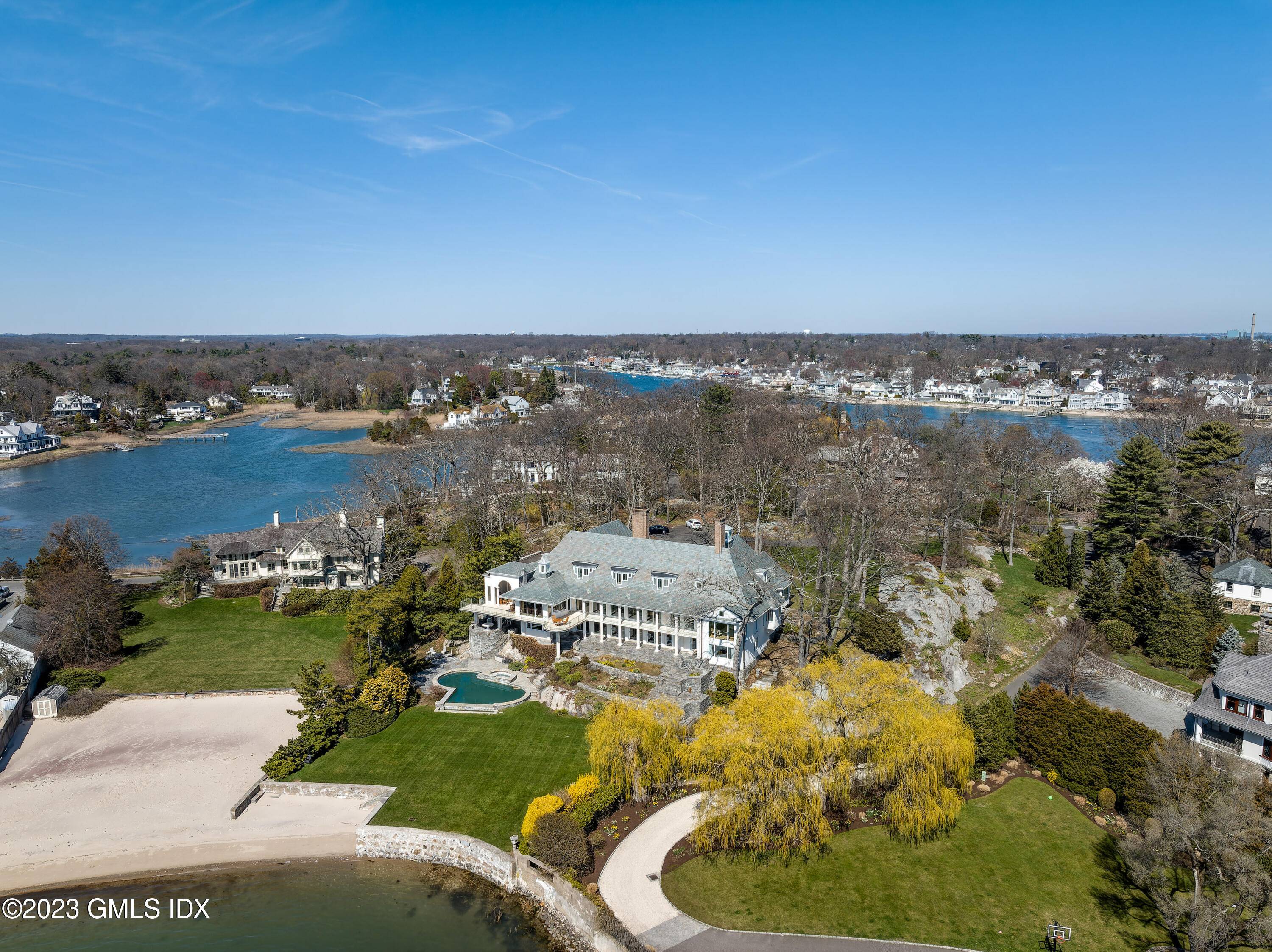 Overlooking Long Island Sound from a natural 32ft stone bluff high above the sea, with 2.