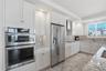 Beautifully designed kitchen with coastal-inspired finishes and Jenn-Air appliances.