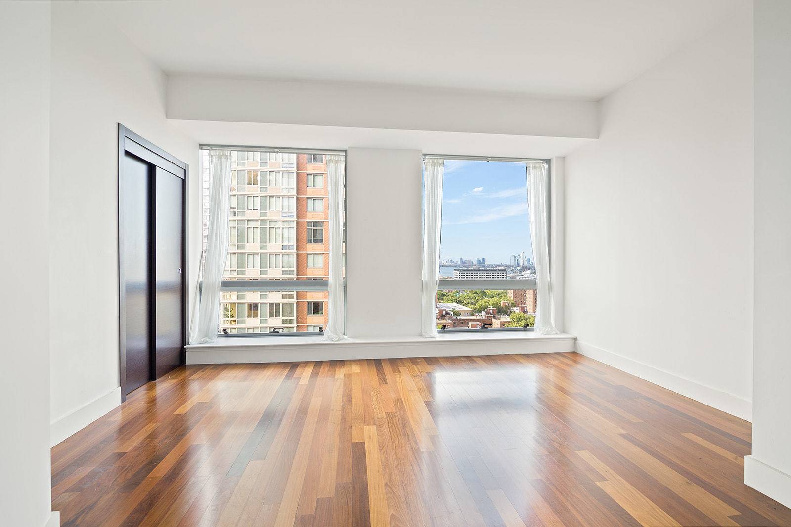 NO BROKER FEE, residence 1402 is a beautiful bright condo studio built with a penthouse loft in mind.