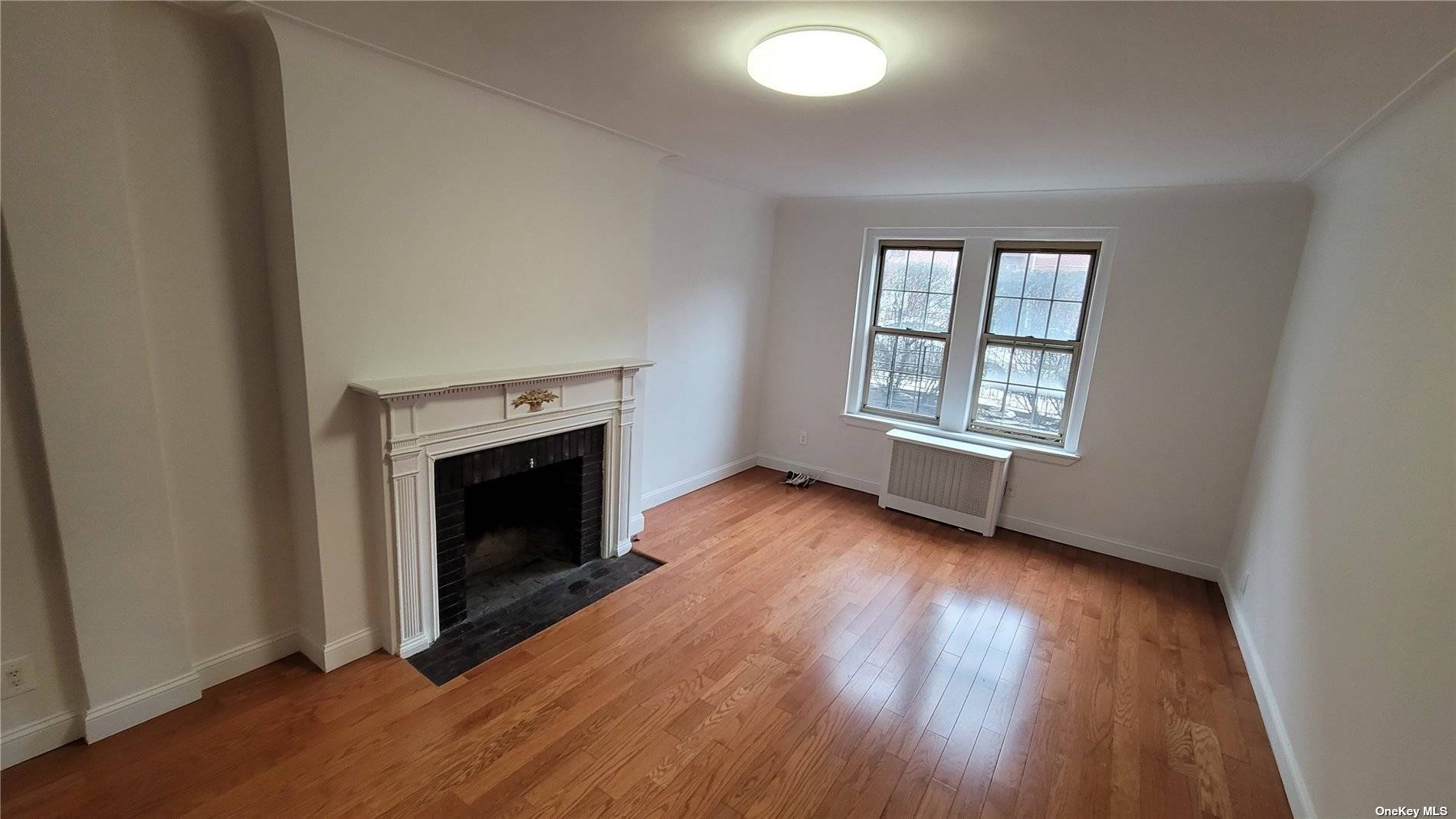 Welcome to this spacious apartment featuring a genuine wood burning fireplace, boasting 9.