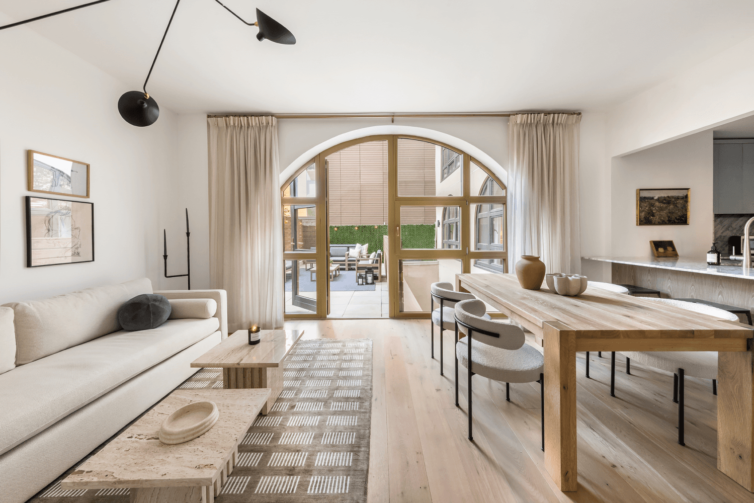 Upon entering this duplex unit, you're greeted by stunning oversized arched windows leading to your private terrace perfect for entertaining and maximum relaxation.