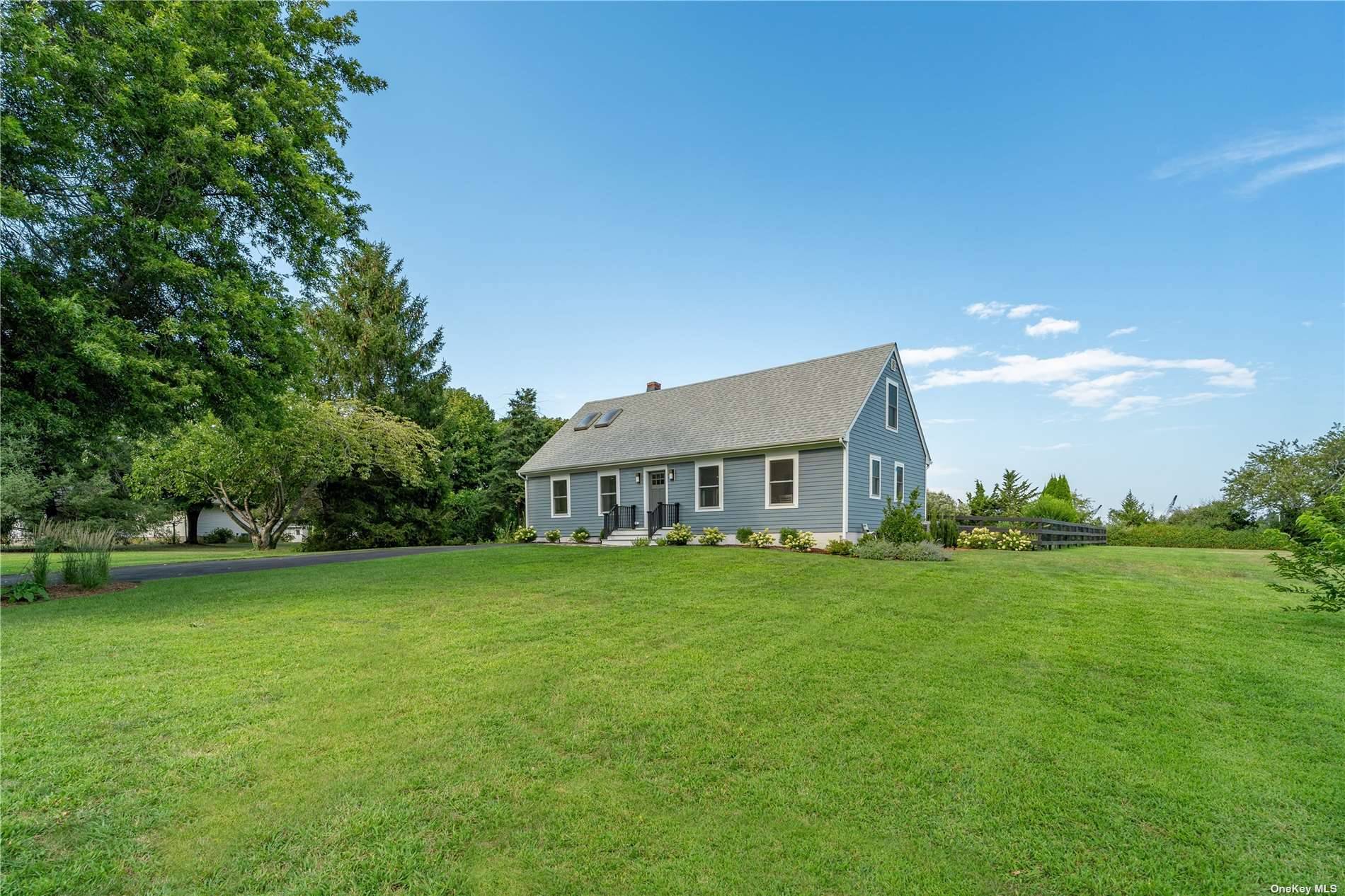Picture yourself living in the midst of the sprawling farms of the North Fork on nearly an acre in the desirable hamlet of Cutchogue.