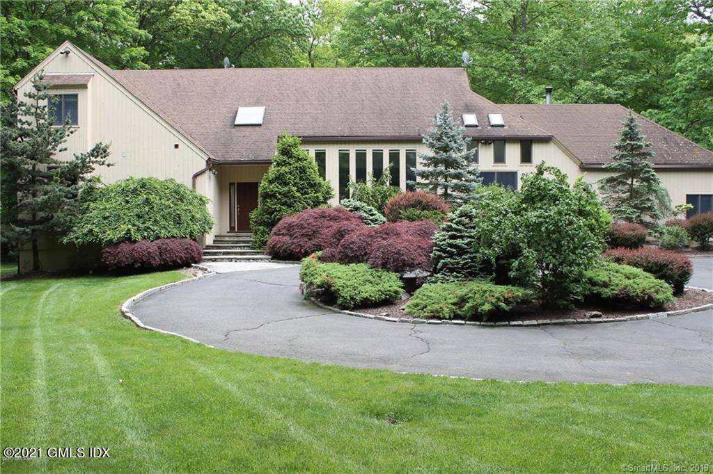 Enjoy privacy and nature in back country Greenwich in a dramatic, spacious 6, 500 sq.
