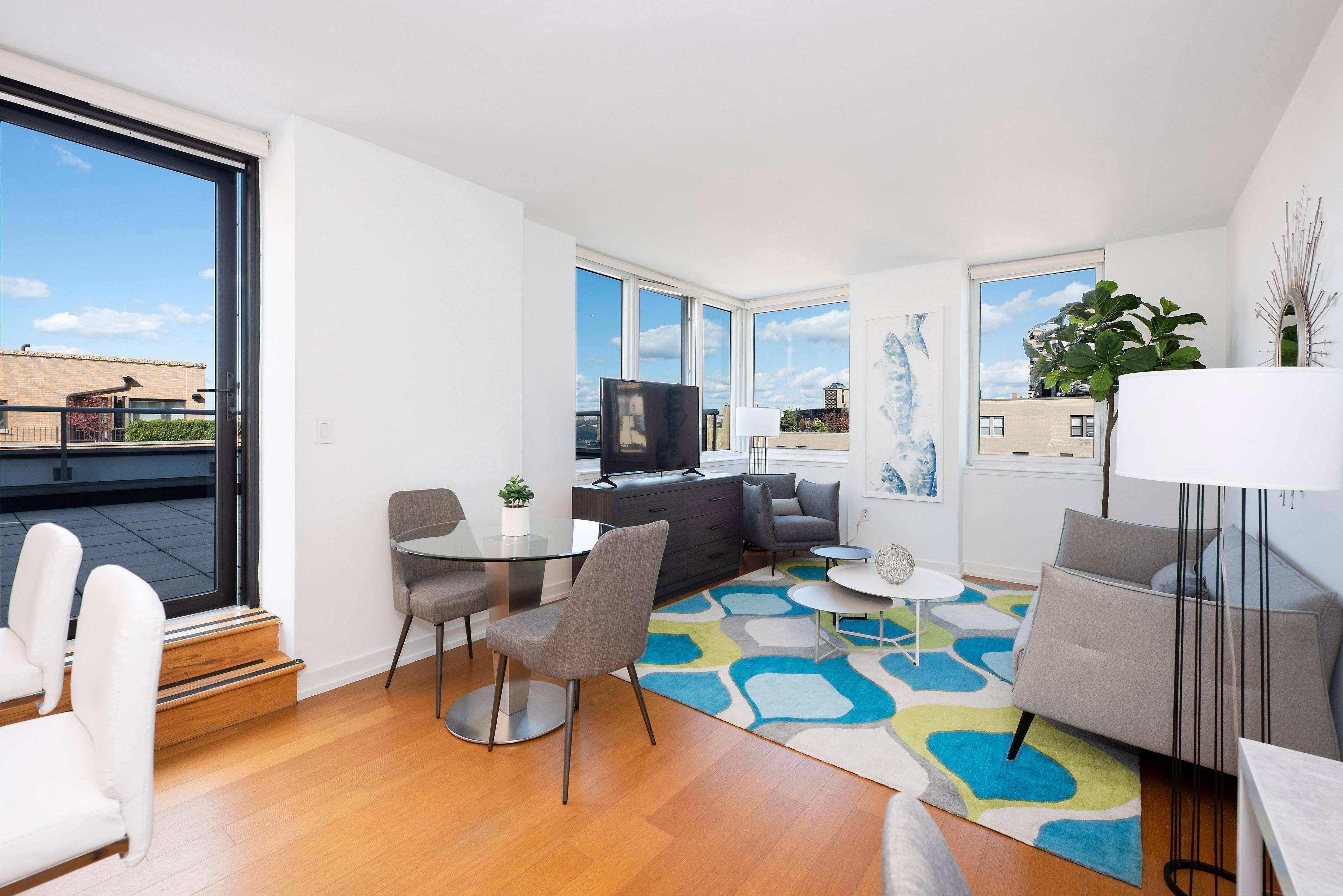 Spacious 2 bedroom with corner windows in living room, open gourmet kitchen with window and eating bar, in unit washer dryer and a large private terrace.