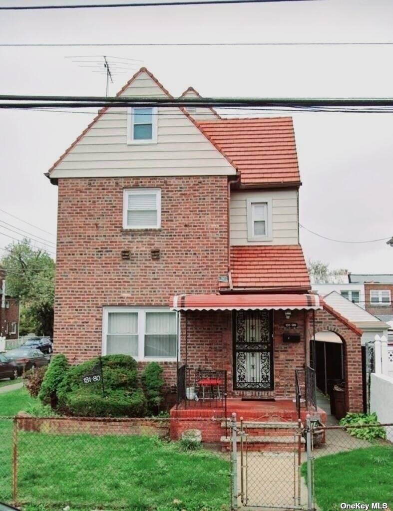 This all Brick, Tudor, 1 Family Detached House, is located on a Corner Lot in the upscale neighborhood of Laurelton.