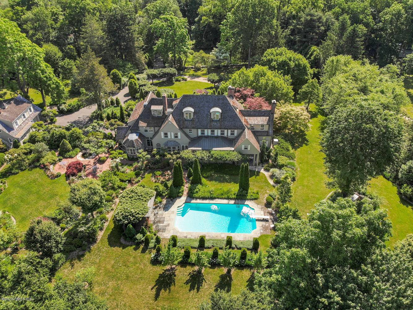 This beautiful country estate with pool and cottage is hidden from view off midcountry Lake Avenue.