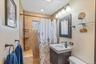Bathroom with vanity and a shower stall