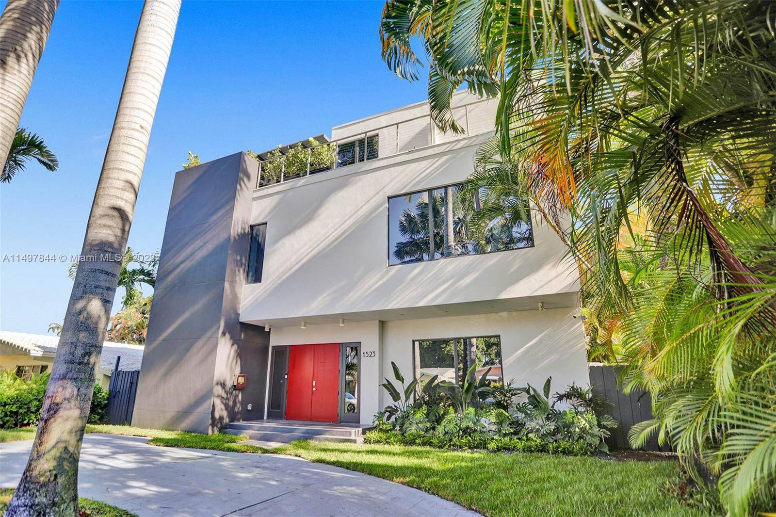 Experience the epitome of luxury living in this tropical contemporary home, nestled on lush Hollywood beach area.
