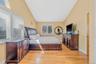 Bedroom featuring lofted ceiling and light wood-type flooring