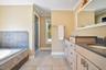 Primary w dual vanity, garden tub, and separate shower
