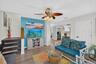 Open living area with coastal-inspired furnishings and bright interiors.