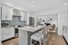 Updated modern kitchen with high-end finishes and appliances open to the living room and dining area allows a wonderful "flow" for entertaining.