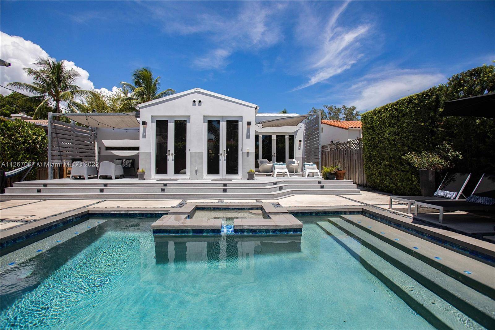 Beautiful 2 2 home in gated Belle Meade, one of Miami s stylish neighborhoods.