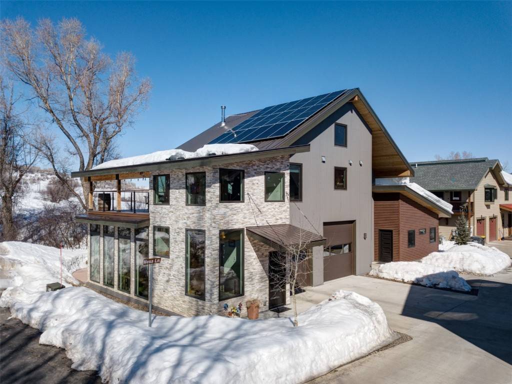 Nestled near the tranquil beauty of Steamboat Springs' Emerald Mountain, this charming home offers a serene escape in a natural setting next to a seasonal stream.