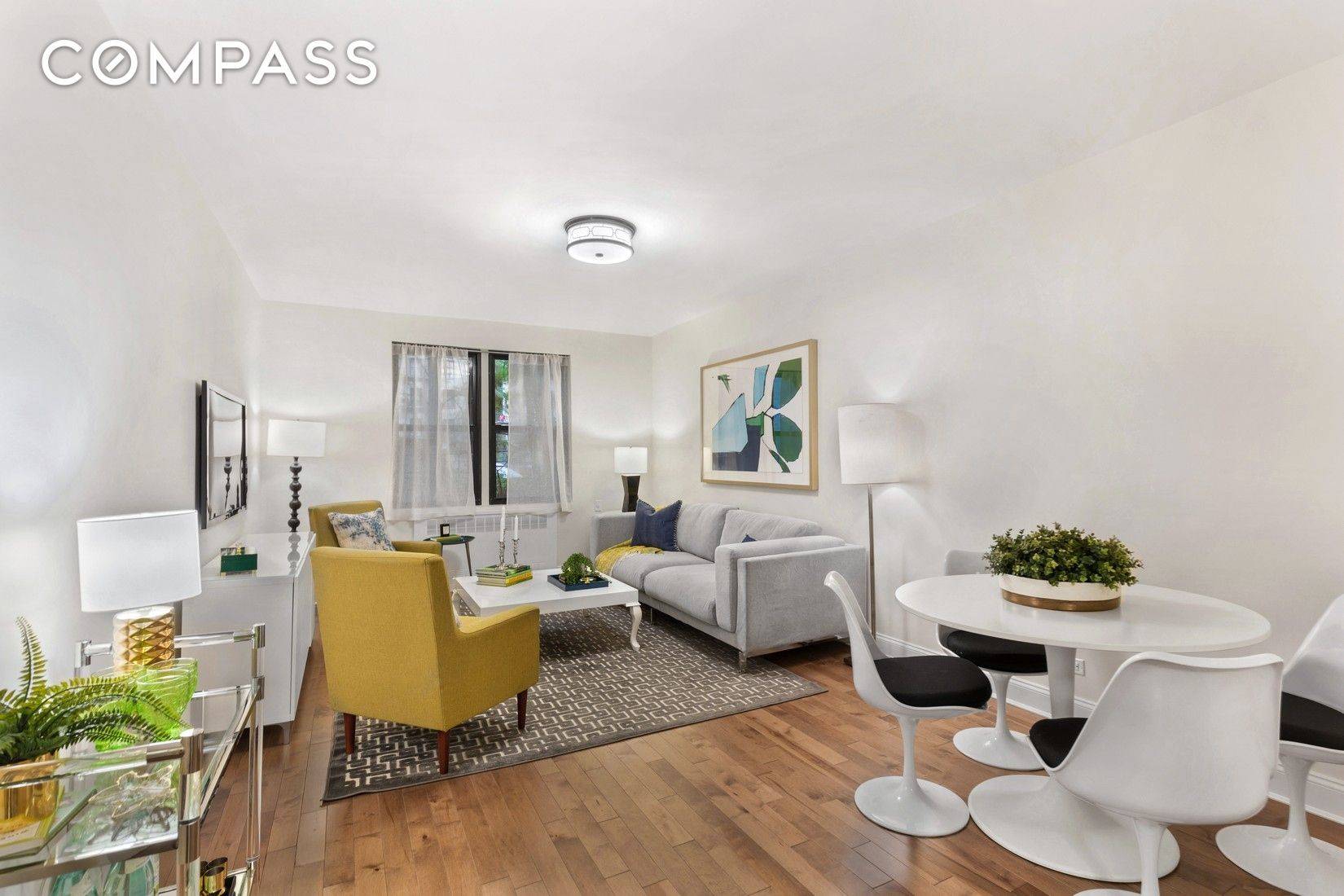 beautifully transformed home boasts a bright, windowed renovated kitchen with sleek stainless steel appliances, modern cabinetry, and updated fixtures.