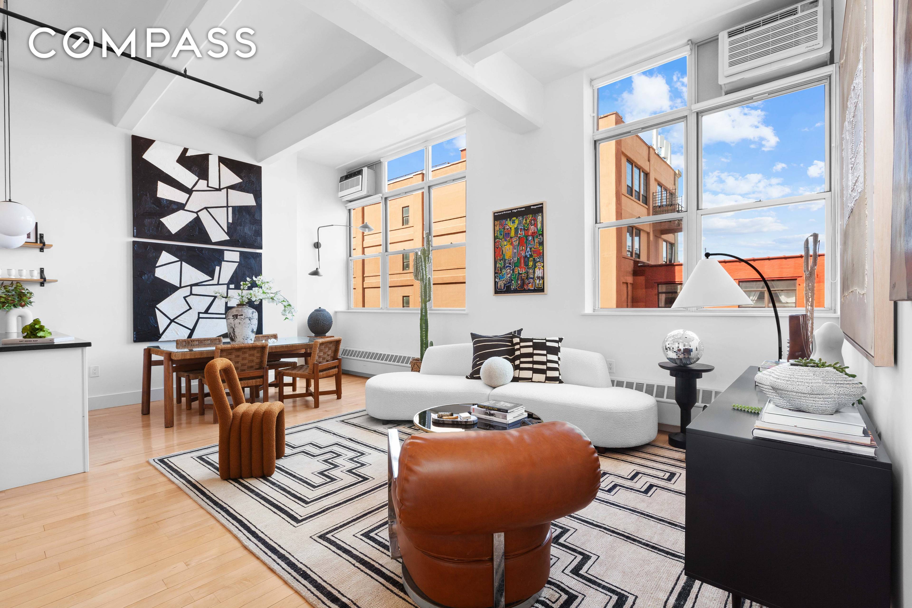 An industrial chic, renovated two bedroom, two bathroom loft with palatial 12 poured concrete beamed ceilings in a full service Clinton Hill condominium.