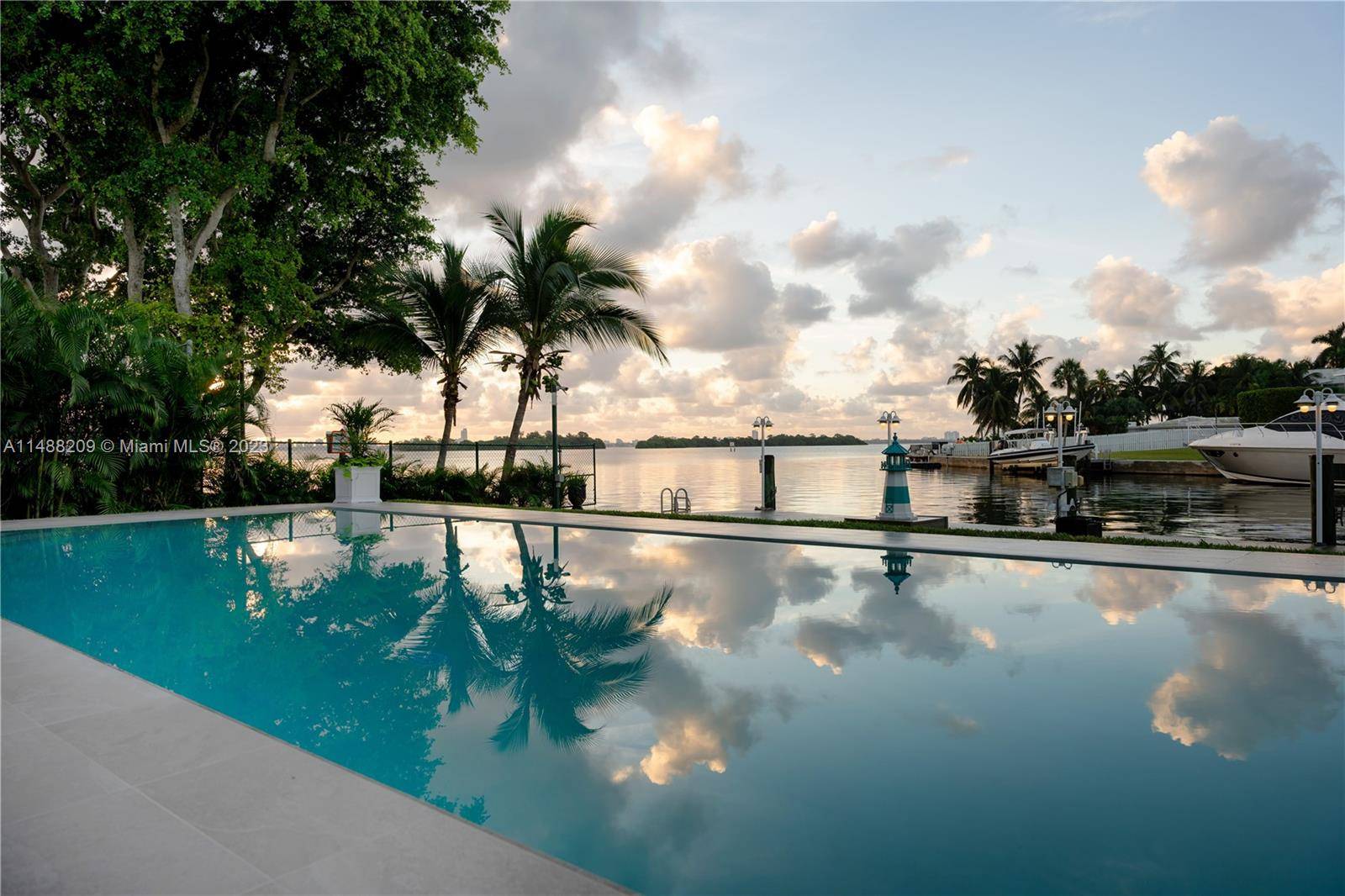 Welcome to this waterfront estate situated on a spacious 12, 815 SF lot, with 120 feet of dock space along Biscayne Bay, perfect for a yacht of 80 feet.