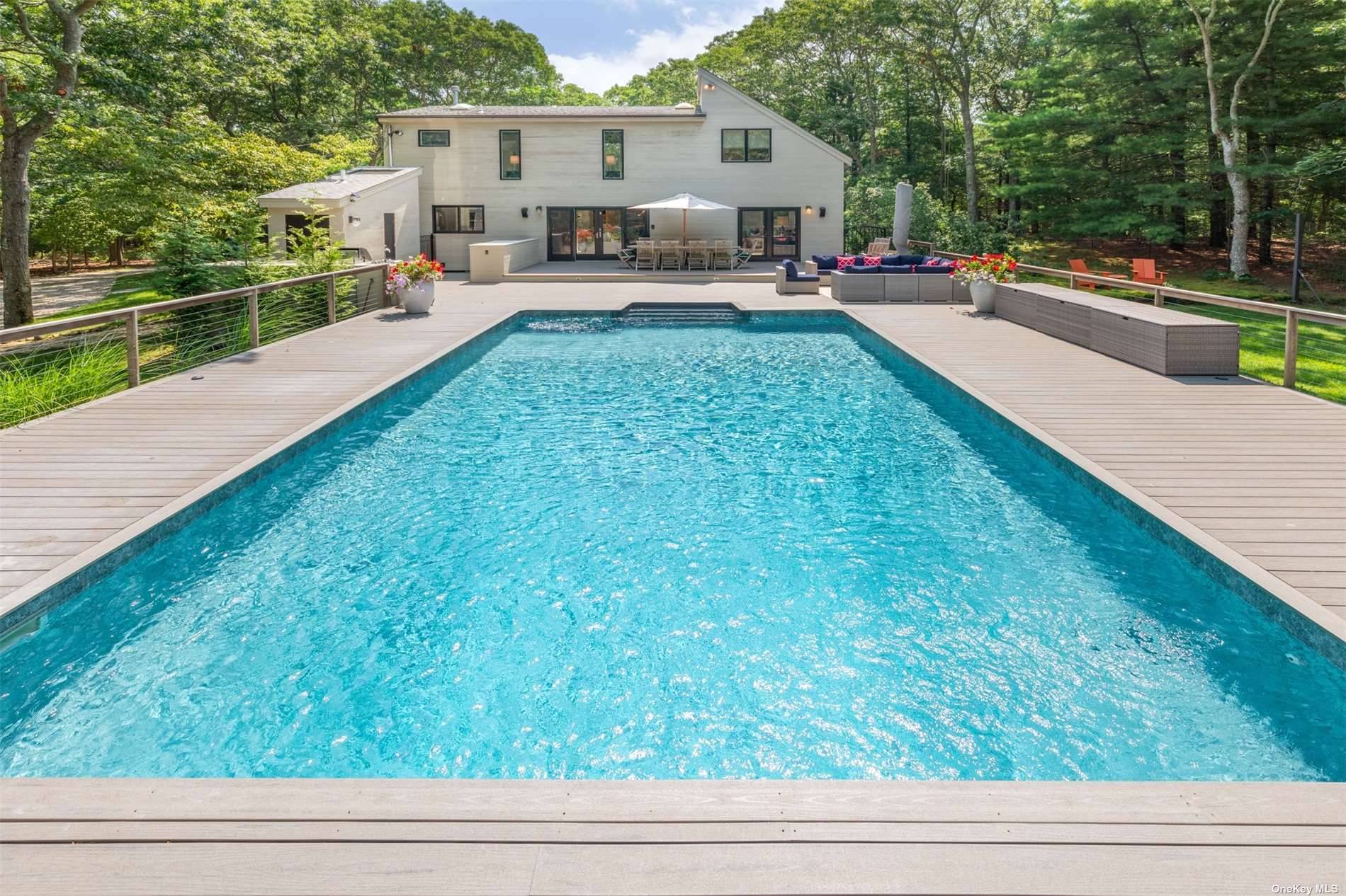 Privately situated in the Northwest Woods of East Hampton on two acres sits this perfectly designed and decorated 3 Bedroom and 3.
