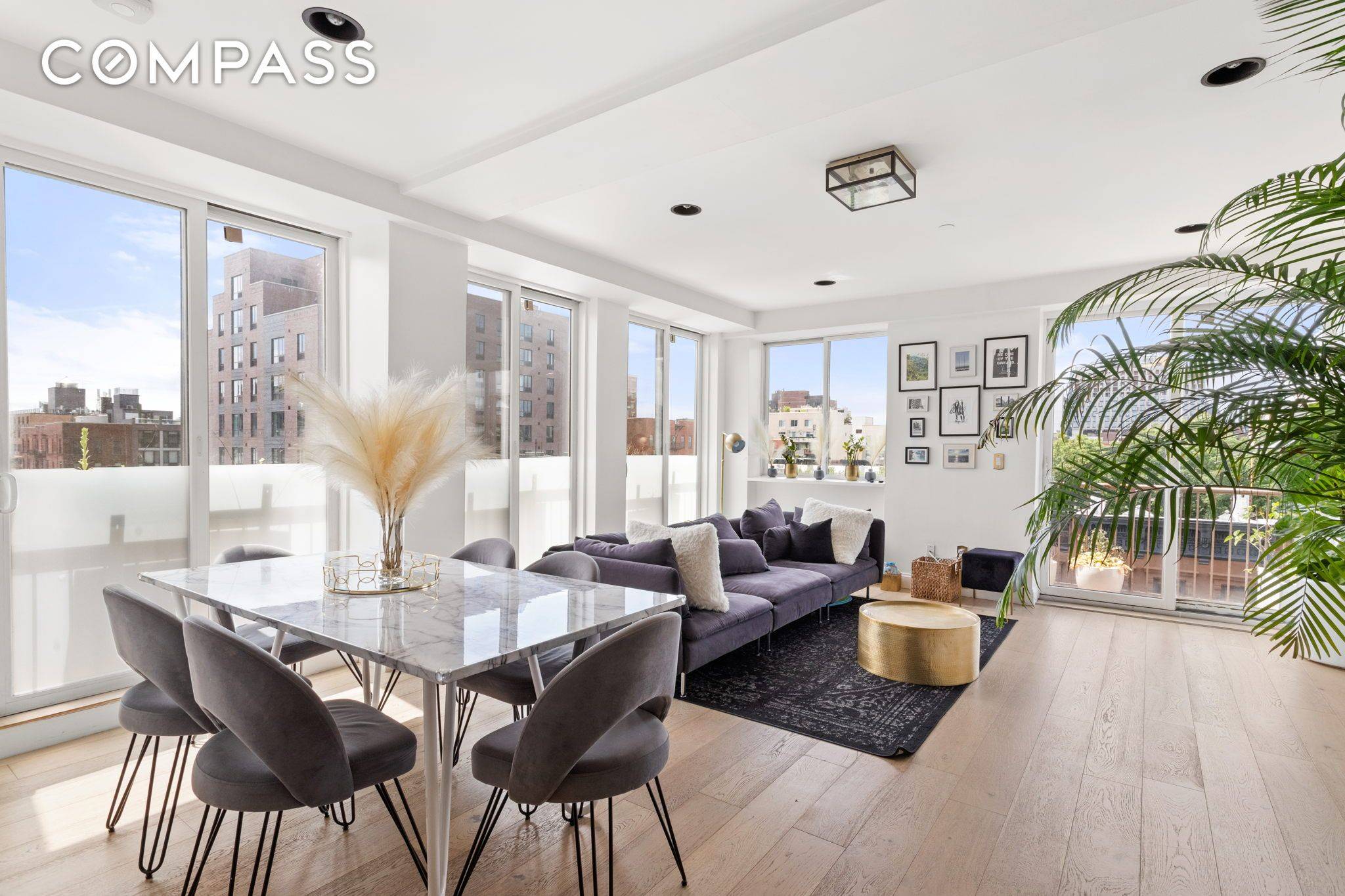 Three bedroom penthouse duplex for sale in Harlem with floor to ceiling windows.