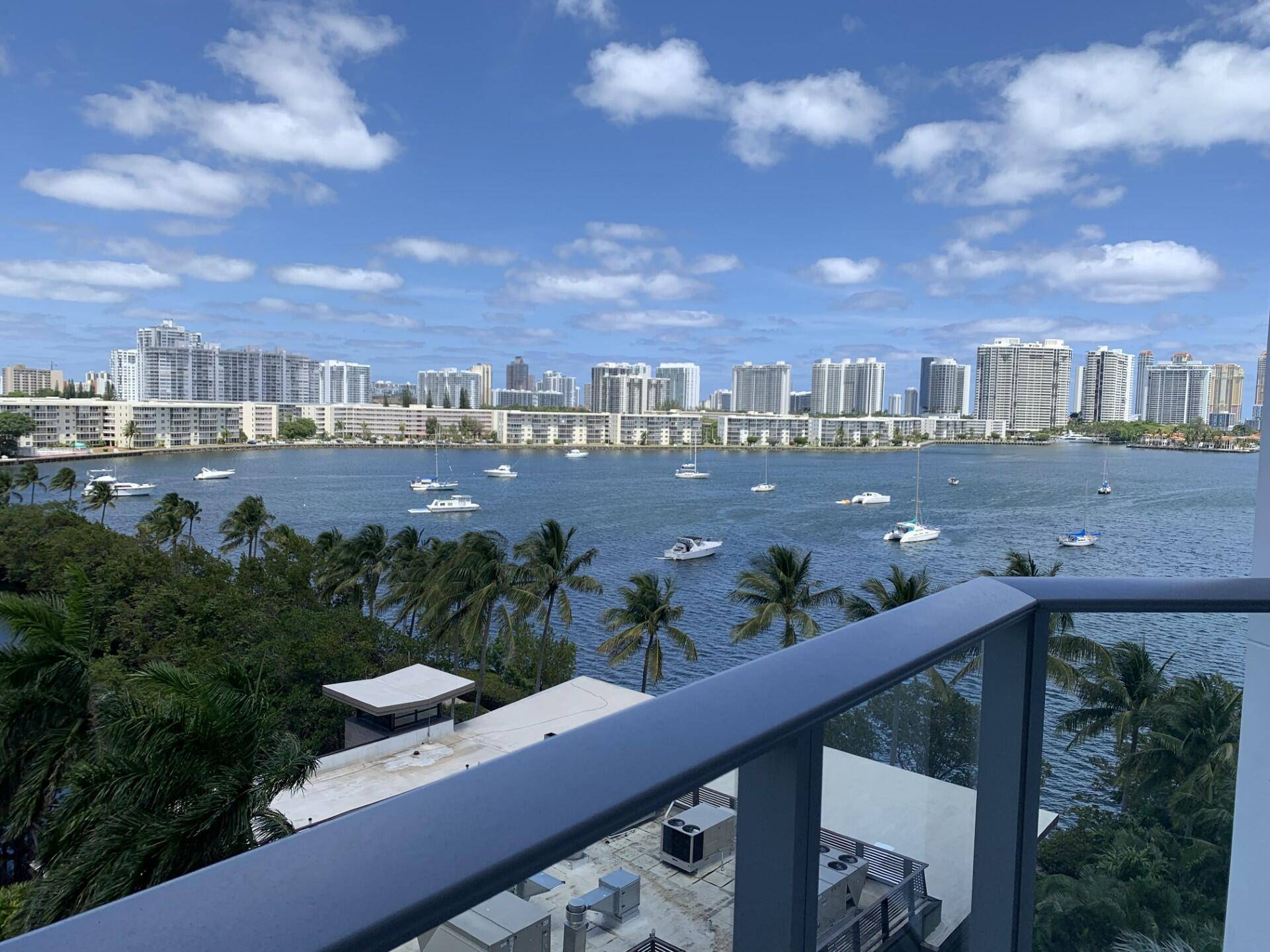 THIS BRIGHT and STUNNING 2 Bed 3 bath Den unit at Marina Palms with a impressive panoramic intracoastal and marina view.