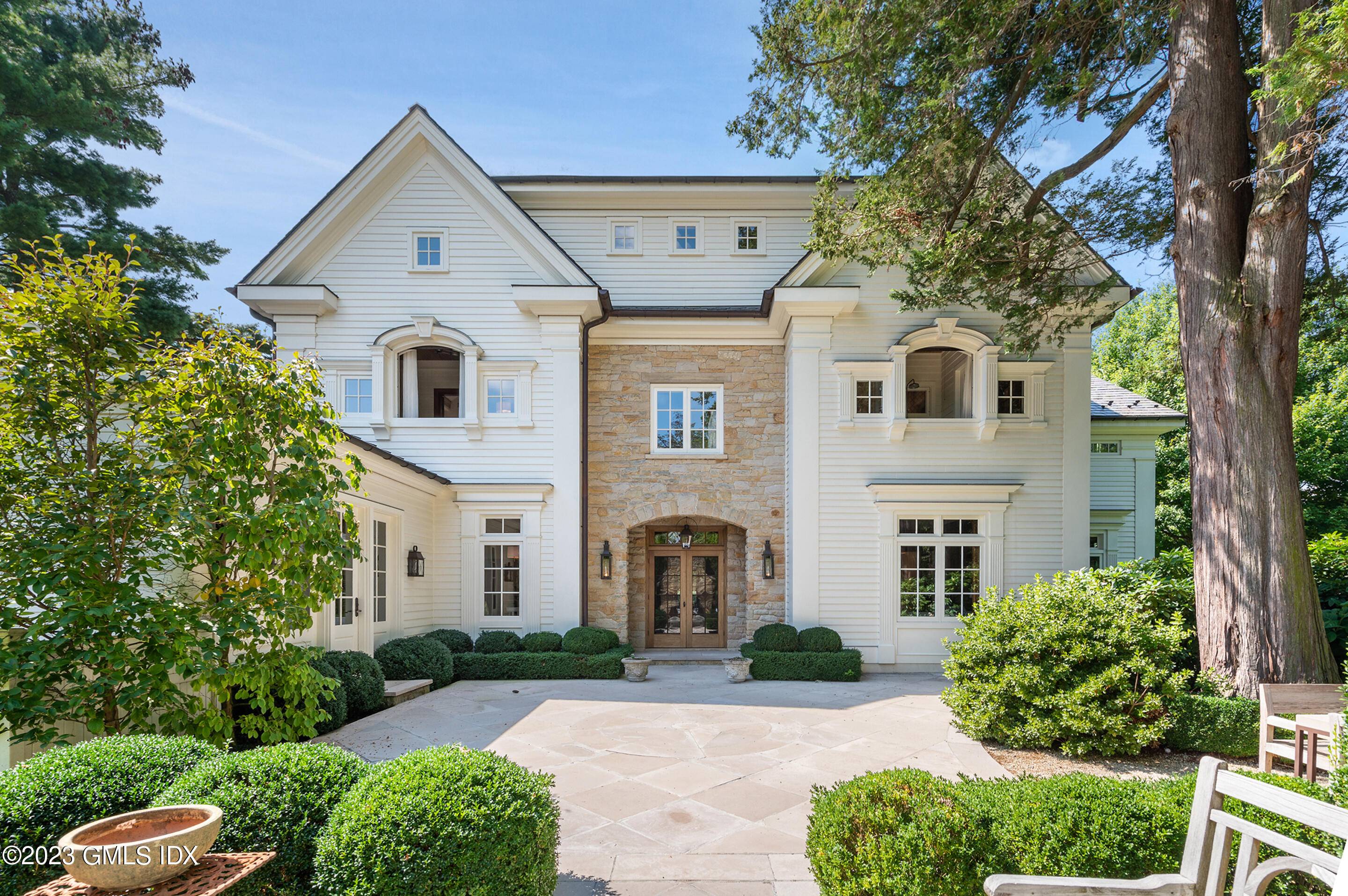 Timeless stone and clapboard center hall Colonial, hand crafted by legendary Hobbs Custom Builders, exuding quality with its timeless details and beauty.