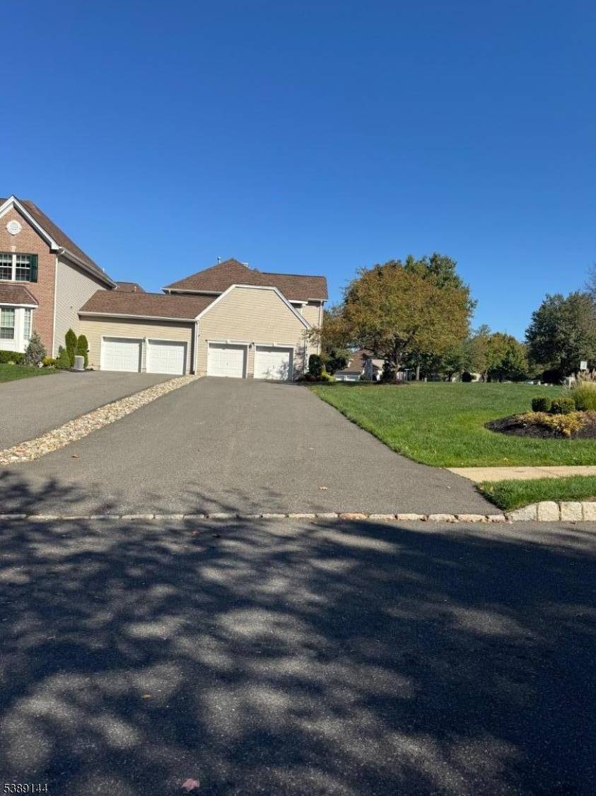 Radcliffe Village 2 Bedroom Carriage house with 2 car Garage, full finished basement, updated Main bath, Eat in Kitchen, Both bedrooms have Full Baths and walk in closet