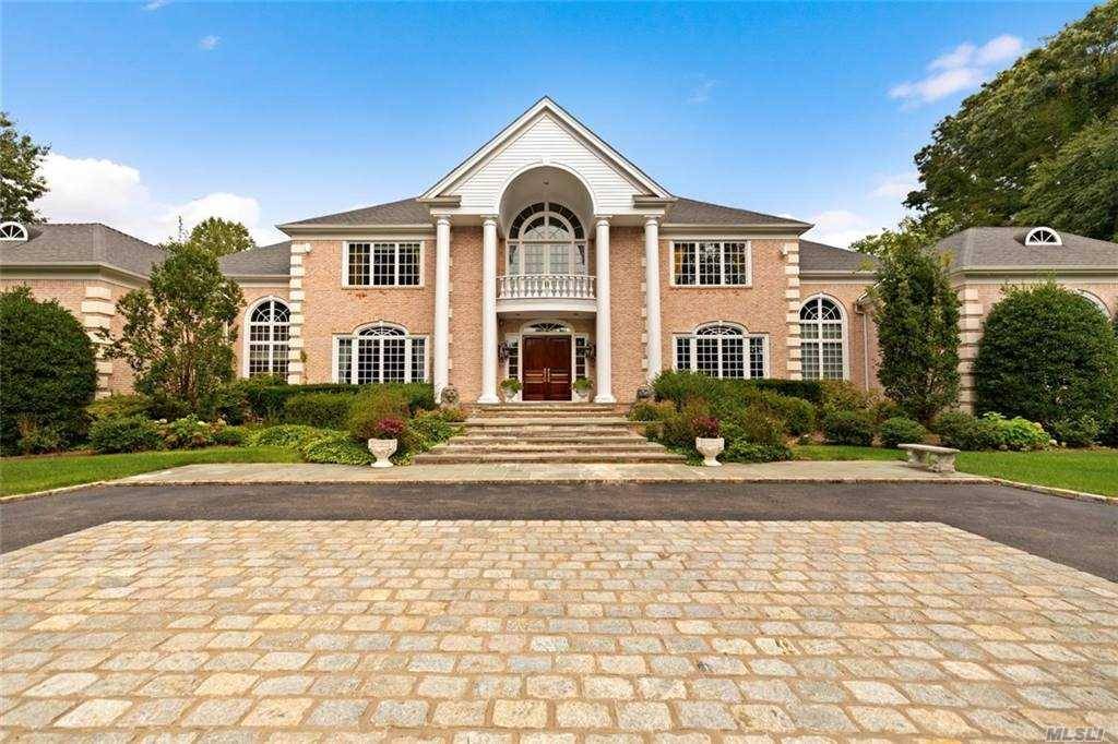 This Elegant Brick Center Hall Colonial Personifies Luxury, Style and Superb Workmanship.