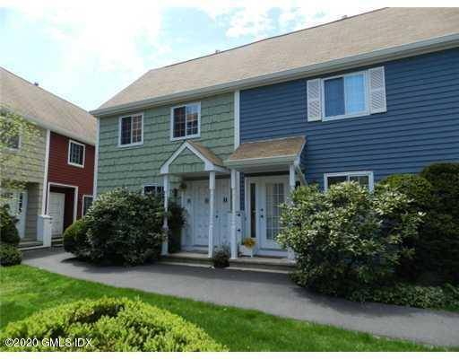Bright, sunny 2 bedroom Meadow Park Townhouse with hardwood floors, eat in kitchen, dining area, living room with fireplace.