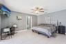 Primary bedroom with view of pool
