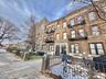View of apartment building / complex with a fenced front yard