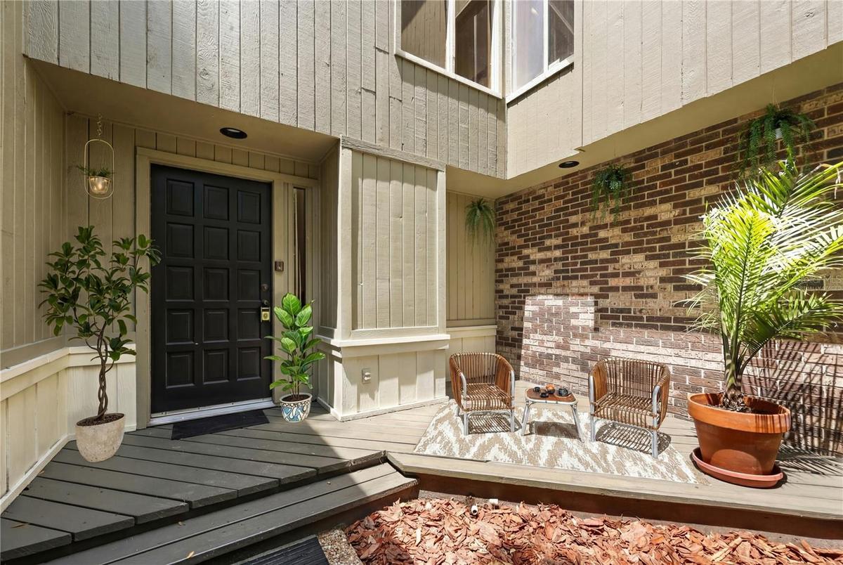 virtually staged private courtyard entrance