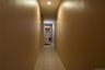 Hall with light tile patterned floors