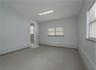 Flex space (400 sqft) with high ceilings, private exterior entrance/exit, and sink/plumbing.