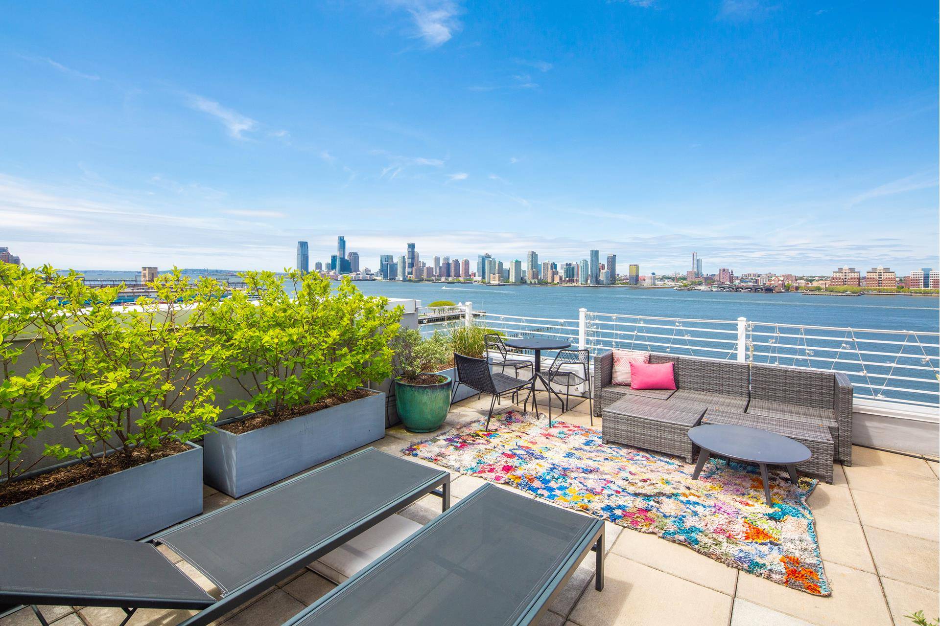 The top SKY PENTHOUSE residence at FOUR23, the West Village's newest coterie of chic loft homes overlooking the Hudson River Park.