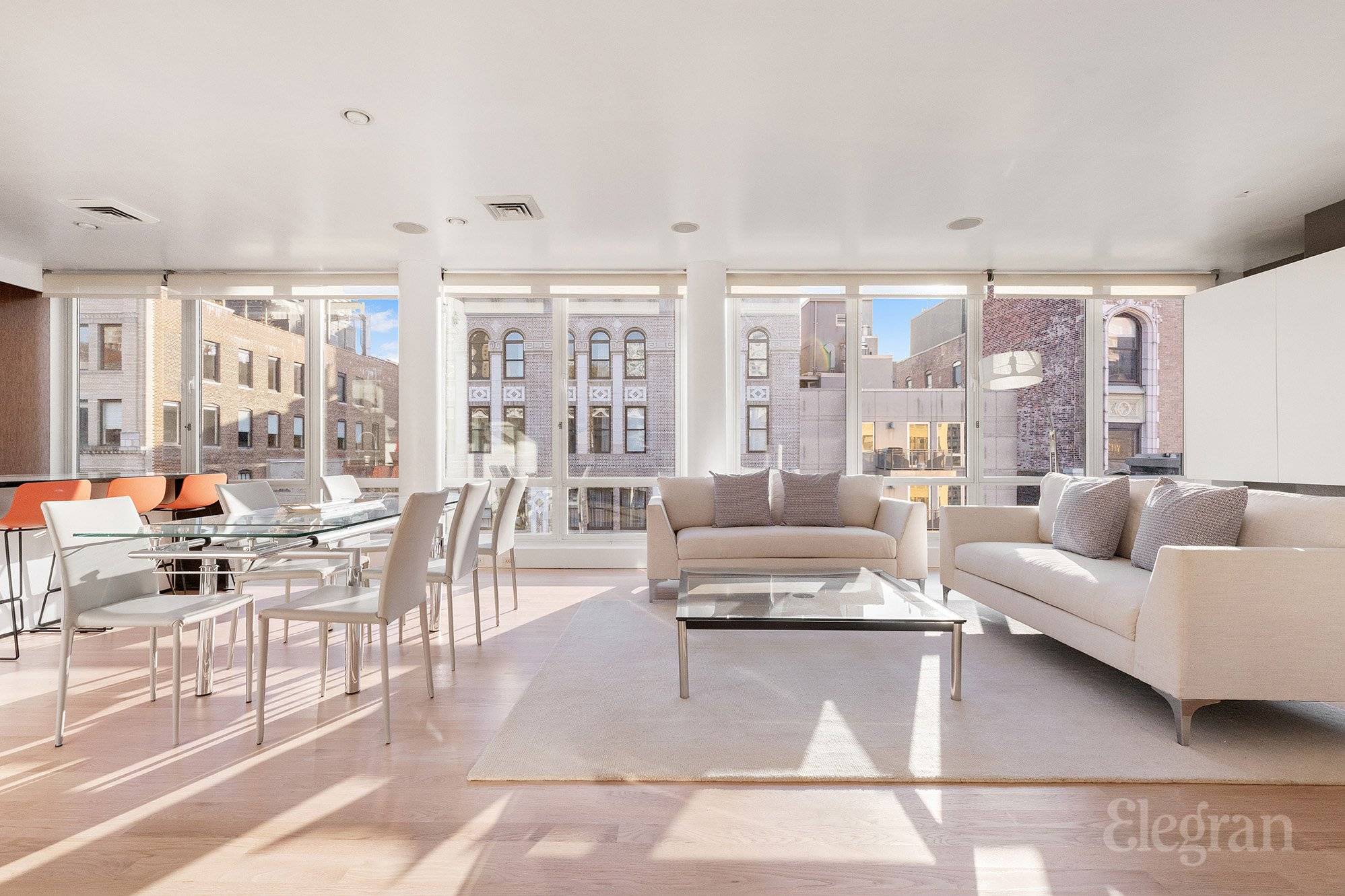 Penthouse B welcomes you in with a massive south facing living space, complete with a fireplace, custom entertainment console, and floor to ceiling glass windows that highlight pre war architecture ...