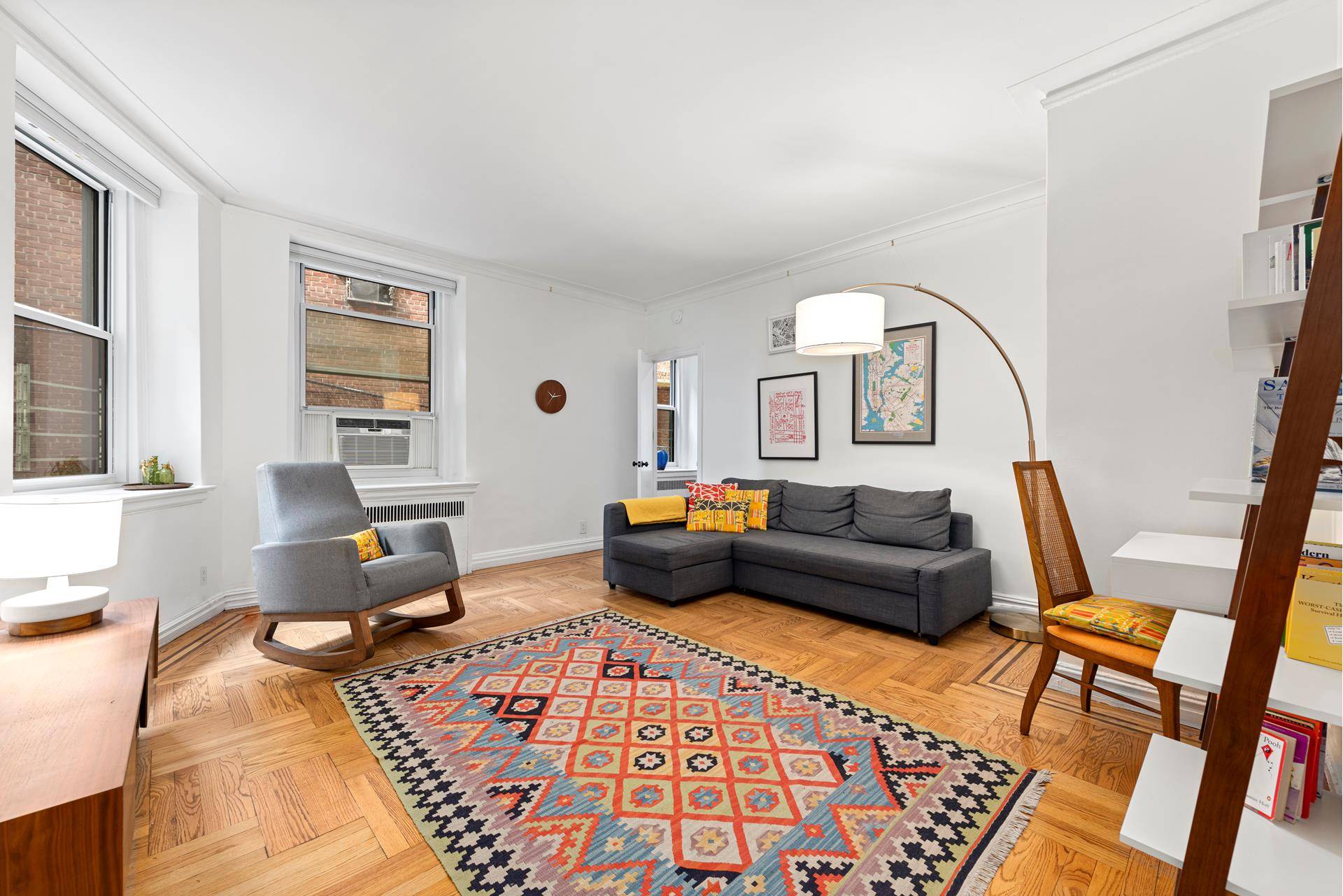 This thoughtfully renovated junior 4 apartment is spacious, sunny, and very charming.