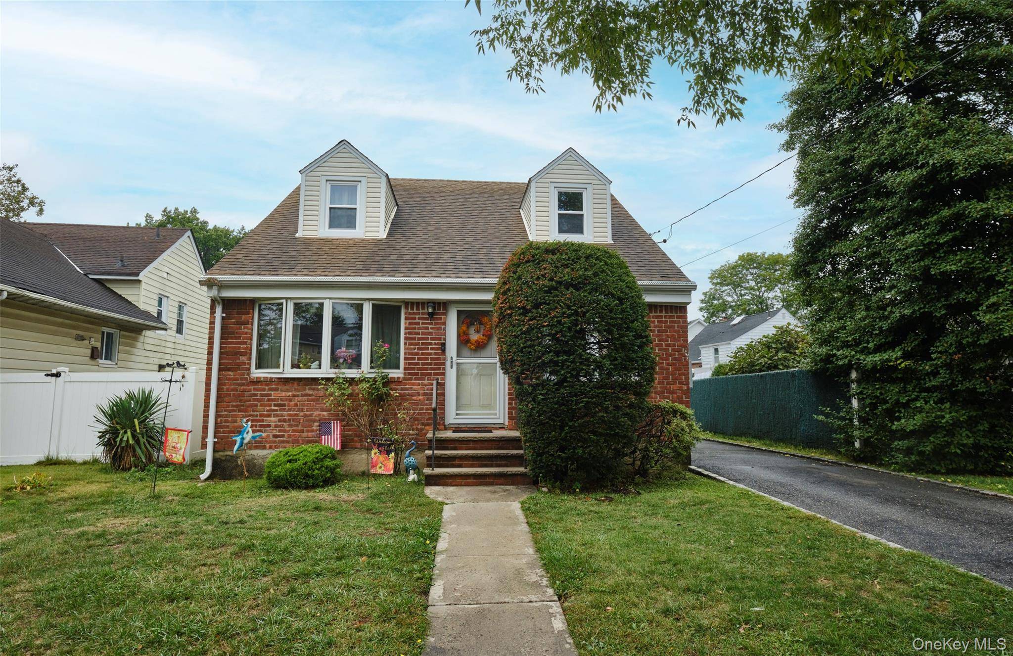 Welcome to this Spacious and Versatile Cape Style Home, Located In The Village of New Hyde Park.