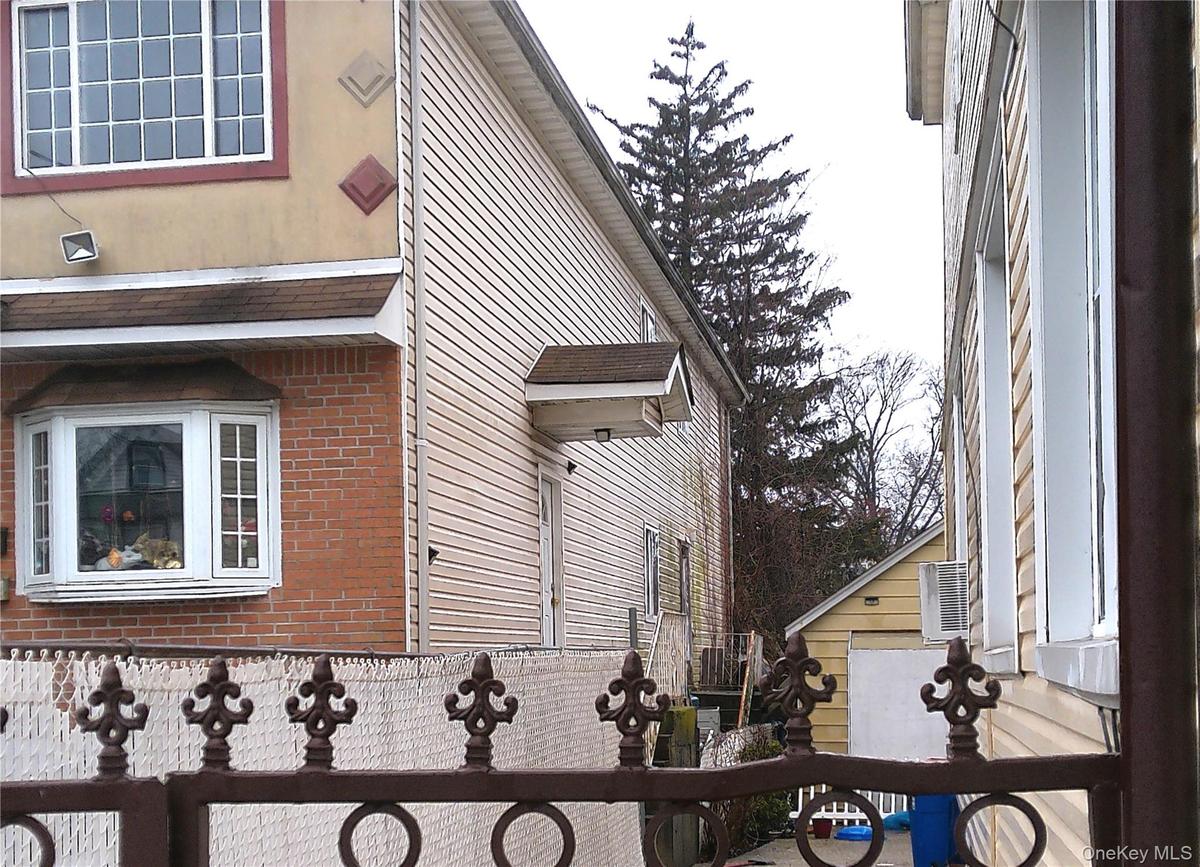 View of side of home featuring brick siding