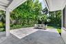 COVERED BACK PATIO area is perfect when you want to be in the shade or just out of the rain, This large newly installed patio area has the best of bot
