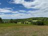 View of wooded area featuring a view of rural / pastoral area