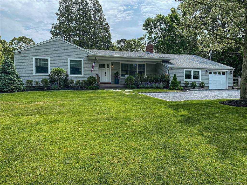 Renovated, immaculate ranch in the Village of Westhampton Beach with open living room, dining area and kitchen.