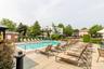 Community pool with a patio area