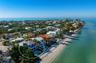 Direct beachfront living at the coveted north end of Anna Maria Island!