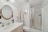 Bathroom with a stall shower and vanity