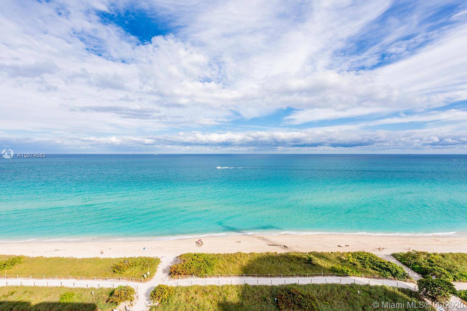 ONE OF A KIND BEACH PENTHOUSE TOP FLOOR UNIT WITH CAPTIVATING UNOBSTRUCTED UNPARALLELED DIRECT VIEWS OF THE OCEAN AND CITY SKYLINE !
