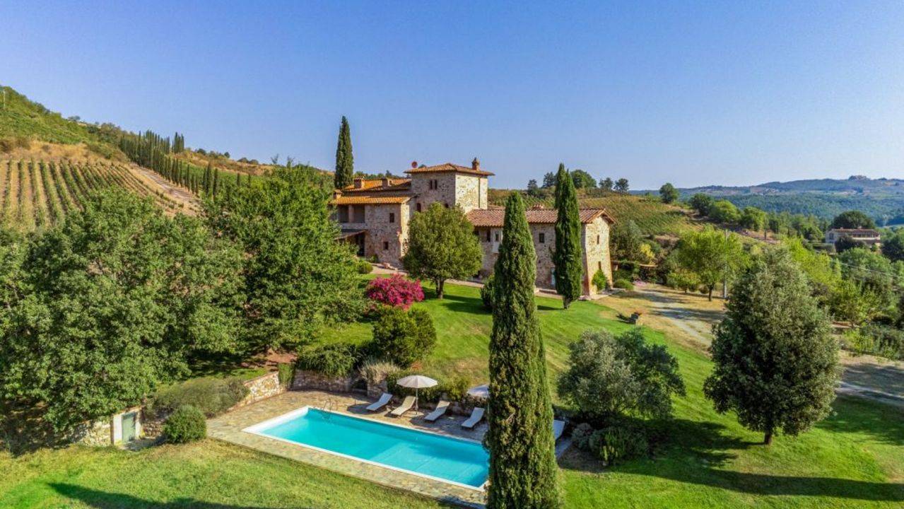 Farmhouse with historical tower on sale, near Siena. It has big swimming pool, garden, 27,5 ha of land with wineyards and olive grove