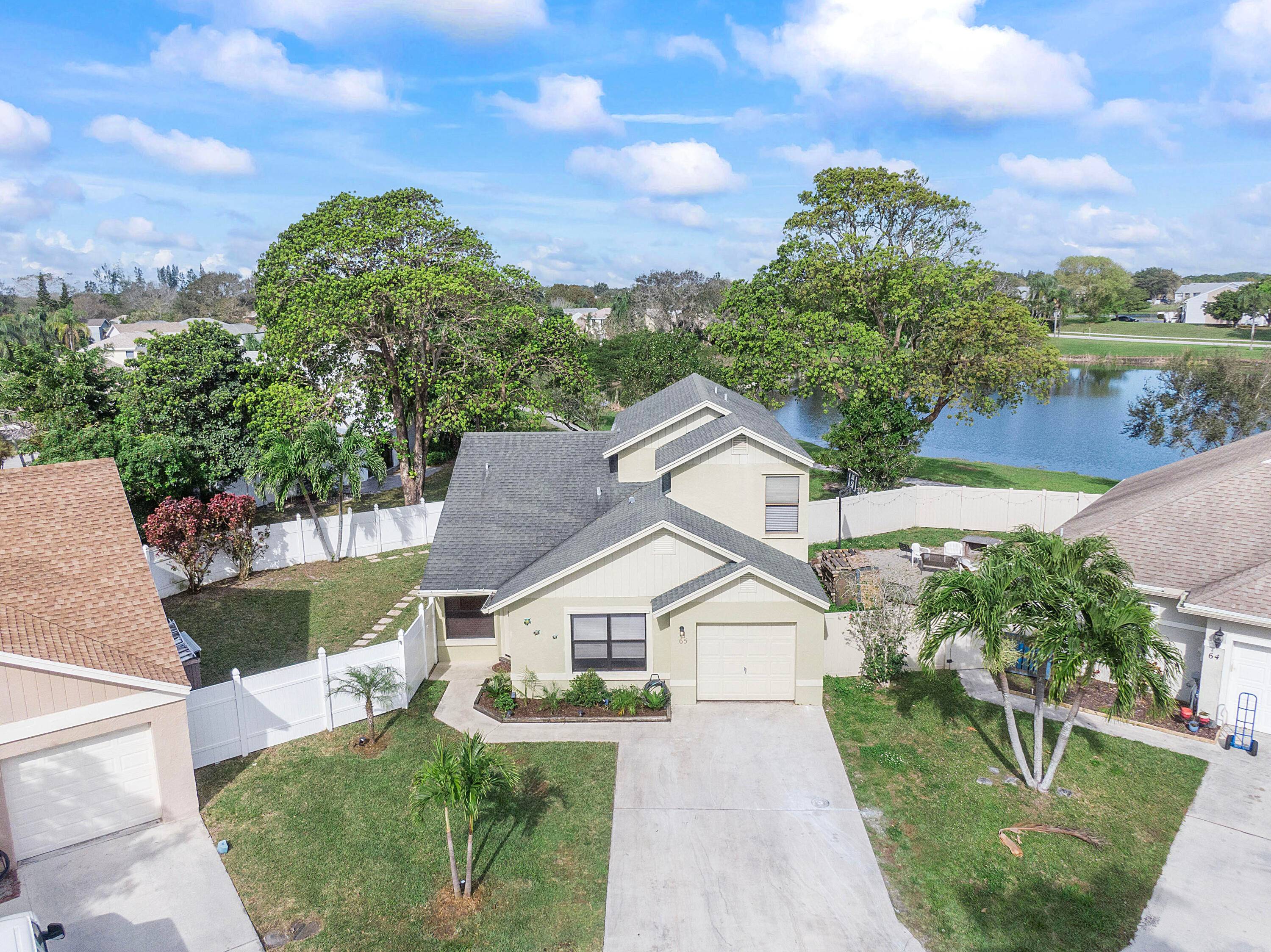 UPGRADED TURN KEY spacious 4 BR LAKEFRONT home only 3 miles to the Ocean !