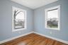 Unfurnished room featuring wood finished floors and baseboards